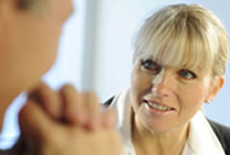 Communication training workshops by Axiom Communications - woman in meeting